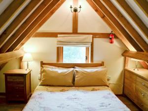 A bed or beds in a room at The Old Dairy 