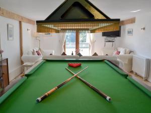 A pool table at Saunders Oast Barn 