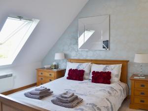 A bed or beds in a room at The Hide Away 