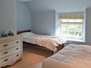 A bed or beds in a room at North House 