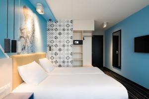 Postel nebo postele na pokoji v ubytování ibis Styles Haarlem City