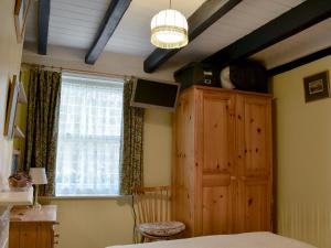 A television and/or entertainment center at St Robert'S Chantry 