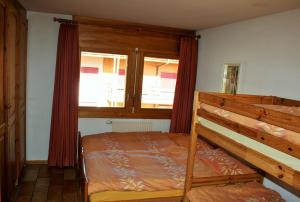 Postel nebo postele na pokoji v ubytování Résidence Castel Club Leysin Parc