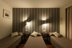 Letto o letti in una camera di Hotel Datini