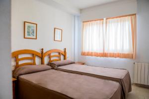 Postel nebo postele na pokoji v ubytování Apartamentos Turisticos Biarritz - Bloque I