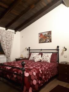 Postel nebo postele na pokoji v ubytování La Camelia B&B