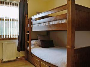 A bunk bed or bunk beds in a room at Bennachie Cottage 