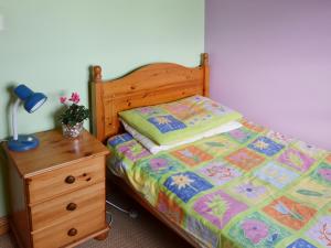A bed or beds in a room at The Hay Barn 
