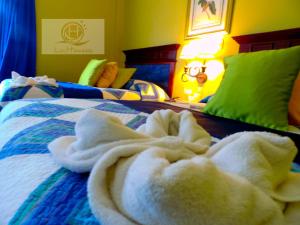 Postel nebo postele na pokoji v ubytování Hotel Las Hamacas