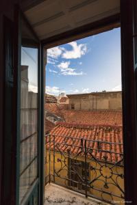 a view of an empty stadium from a window at Hostel Covent Garden in León