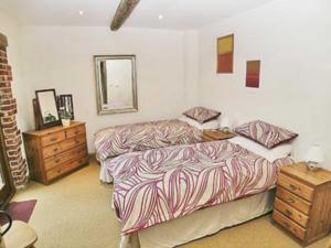 A bed or beds in a room at North Barn 