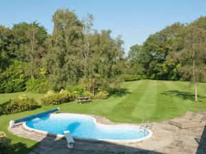 an overhead view of a swimming pool in a garden at Silverland in Hordle