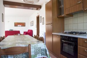 a kitchen with a table and a stove top oven at Agriturismo Gaspari Farm in Volta Mantovana