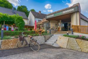 a bike parked in front of a building at Gasthof Zur Traube in Grein