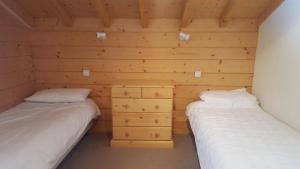 Postel nebo postele na pokoji v ubytování Chalet Orlando