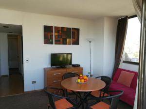 TV a/nebo společenská místnost v ubytování Edificio Maya