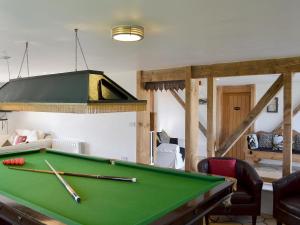 A pool table at Saunders Oast Barn 