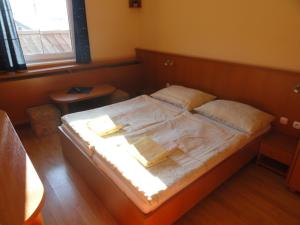 Кровать или кровати в номере Penzion Eka