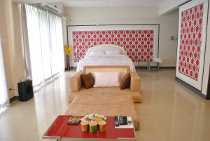 En eller flere senge i et værelse på O.U.M. Hotel - โรงแรมโอยูเอ็ม