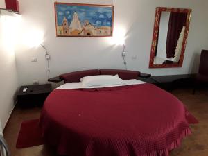 Ένα ή περισσότερα κρεβάτια σε δωμάτιο στο La Dimora dell' Architetto