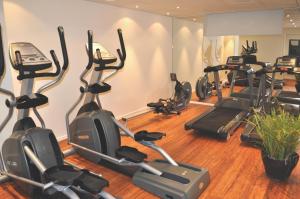 a gym with several exercise bikes in a room at Trosa Stadshotell & Spa in Trosa