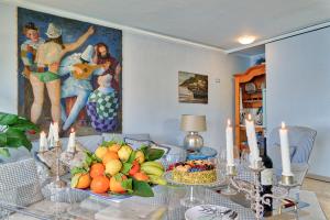 a dining room with a table with fruit on it at Luxury Apartment and Charm Sea View Isola Bella in Taormina