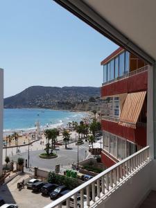 a balcony of a building with a view of the beach at BlancMar Apartament in Calpe