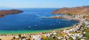 an aerial view of a beach with boats in the water at Gorgona Studios in Livadion