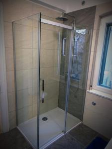 a shower with a glass door in a bathroom at Piazza Old Town Apartment in Split +49 photos