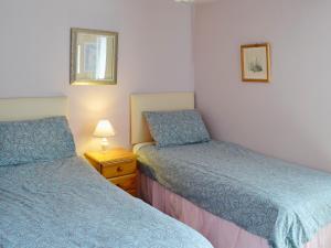 A bed or beds in a room at The Barn 