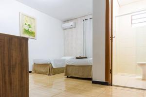 Postel nebo postele na pokoji v ubytování Hotel Holiday Foz