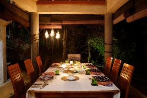 a table in an outdoor dining area with a tableablish at Villa Vista Haldummulla in Haputale