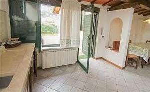 a bathroom with a shower and a sink and a mirror at Villino Michela in Marina di Pietrasanta