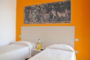 Postel nebo postele na pokoji v ubytování V&V Suite & Breakfast