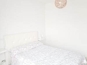 Postel nebo postele na pokoji v ubytování Apartamento Playa Agaete