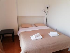 A bed or beds in a room at Sfiggos 54 Guest House