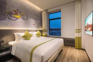 Katil atau katil-katil dalam bilik di Citadines Gaoxin Xi'an