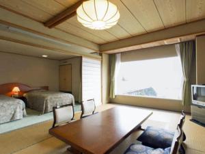 Postel nebo postele na pokoji v ubytování Shimoda View Hotel