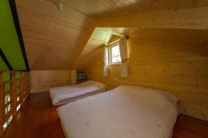 Postel nebo postele na pokoji v ubytování Yun Shang Tai Yang
