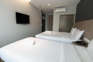 Postel nebo postele na pokoji v ubytování Hotel 99 SS2 Petaling Jaya