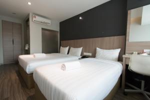 Postel nebo postele na pokoji v ubytování Hotel 99 SS2 Petaling Jaya