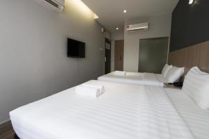 Postel nebo postele na pokoji v ubytování Hotel 99 SS2 Petaling Jaya