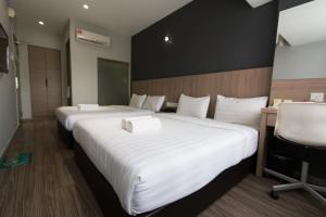 Postel nebo postele na pokoji v ubytování Hotel 99 SS2 Petaling Jaya