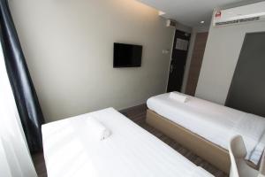 Postel nebo postele na pokoji v ubytování Hotel 99 SS2 Petaling Jaya