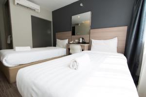 Postel nebo postele na pokoji v ubytování Hotel 99 SS2 Petaling Jaya