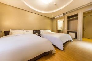 Cama o camas de una habitación en Hotel Seattle Incheon Airport