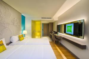 A television and/or entertainment center at ibis Styles Siem Reap