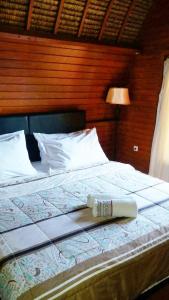 Un pat sau paturi într-o cameră la Gili Desa
