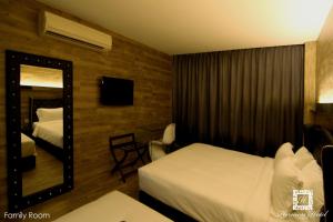 Voodi või voodid majutusasutuse Hermess Hotel Johor toas