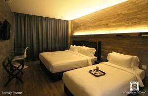 Krevet ili kreveti u jedinici u objektu Hermess Hotel Johor